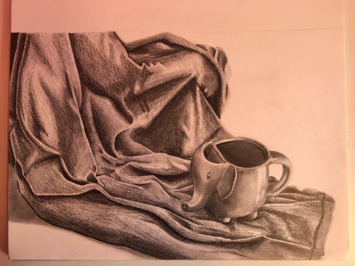 Pencil drawing of an elephant-shaped mug on limp fabric